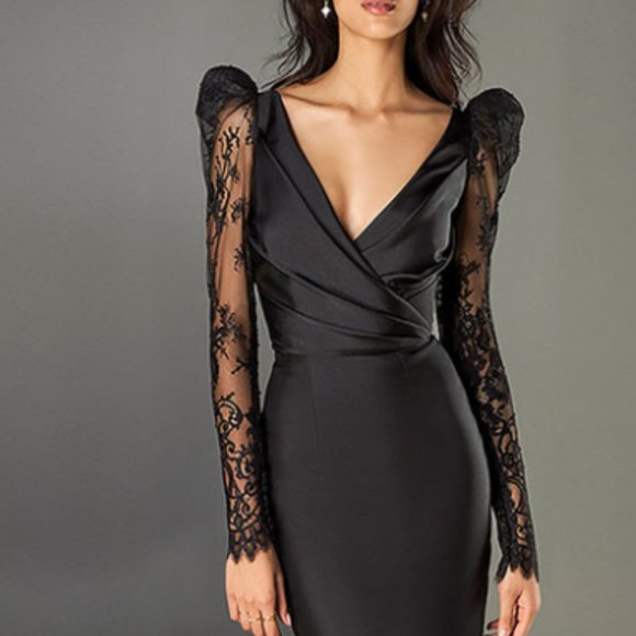A black dress with a V-neck and a slim skirt